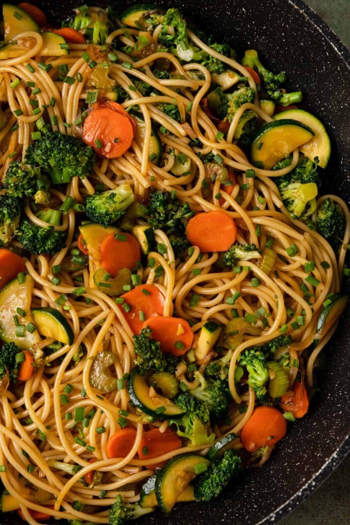 Stir Fry Garlic Noodles and veggies in a pan close up