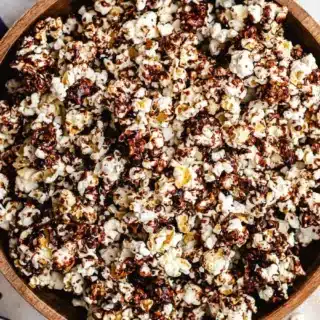 Bowl of popcorn with sweet saucy topping.