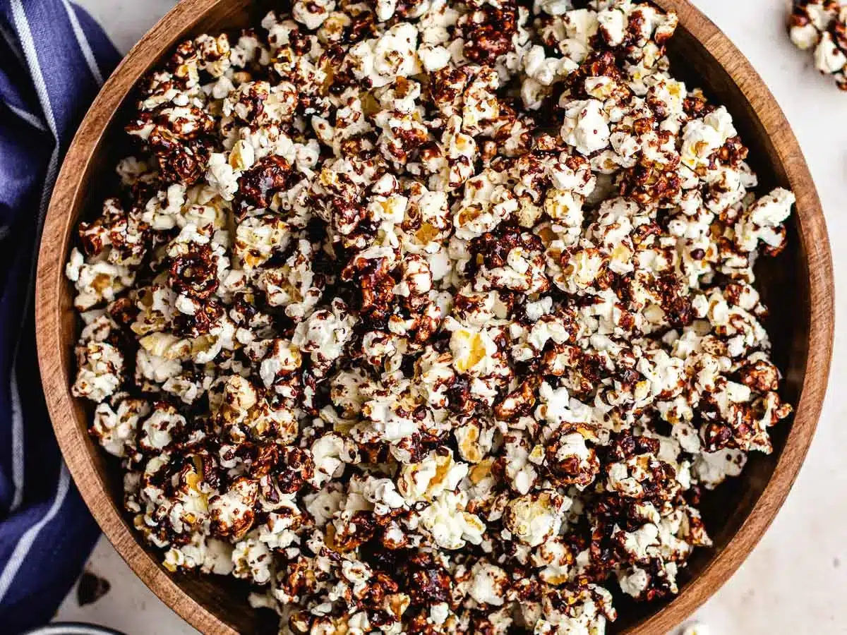 Bowl of popcorn with sweet saucy topping.