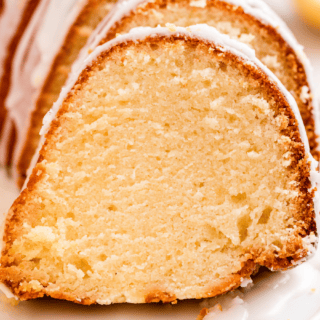 slices of cake with icing on a whtie plate