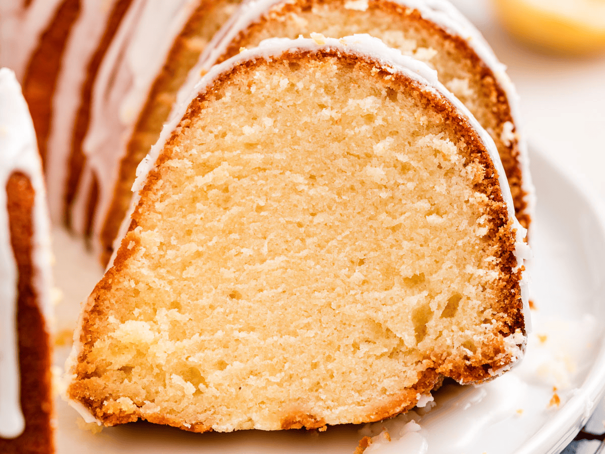 slices of cake with icing on a whtie plate