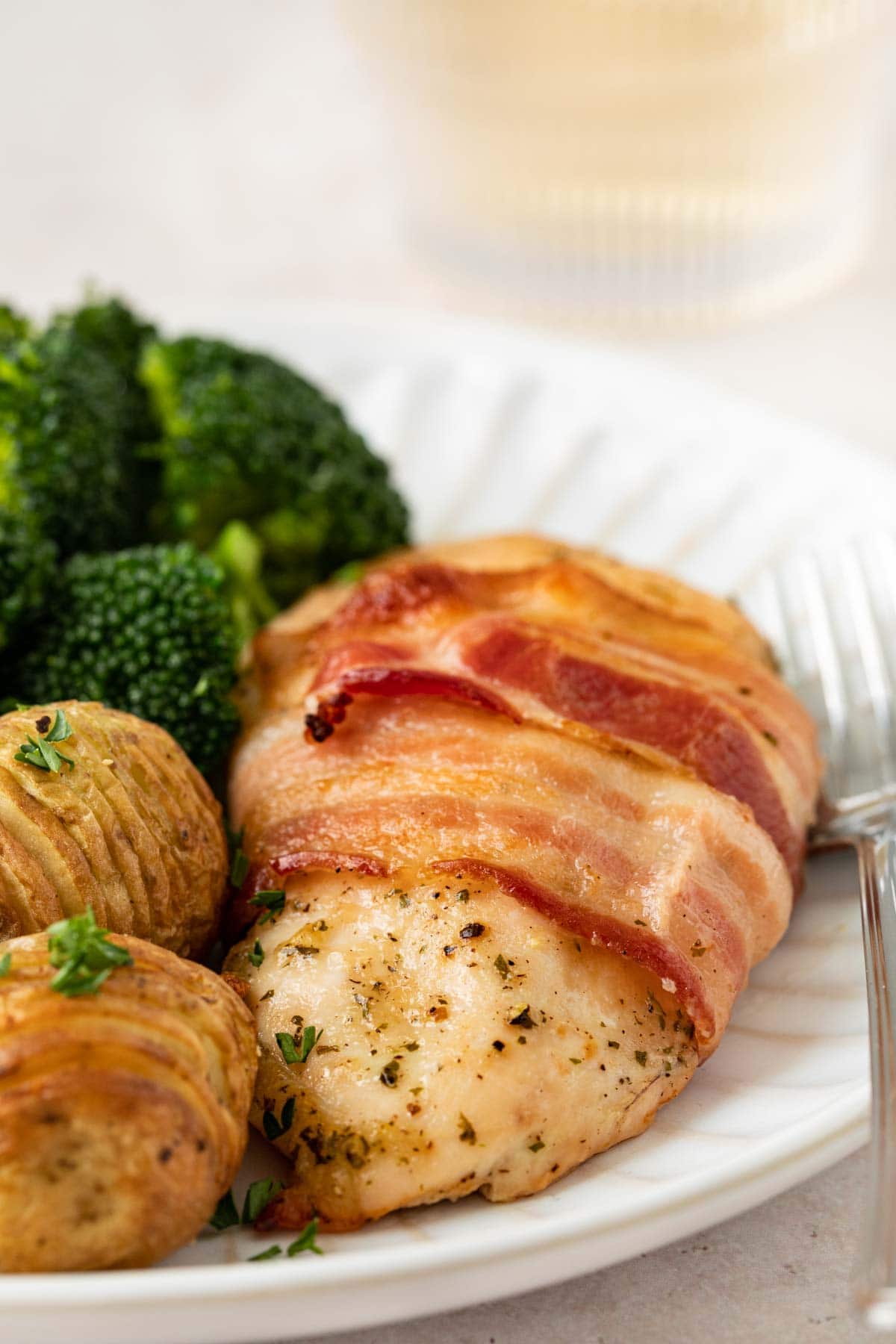 plated piece of chicken with broccoli and potatoes 