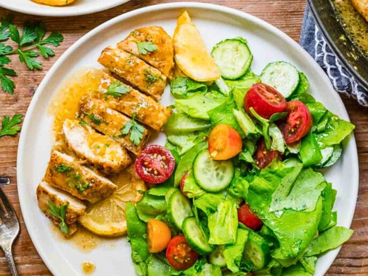 Chicken with sauce and salad