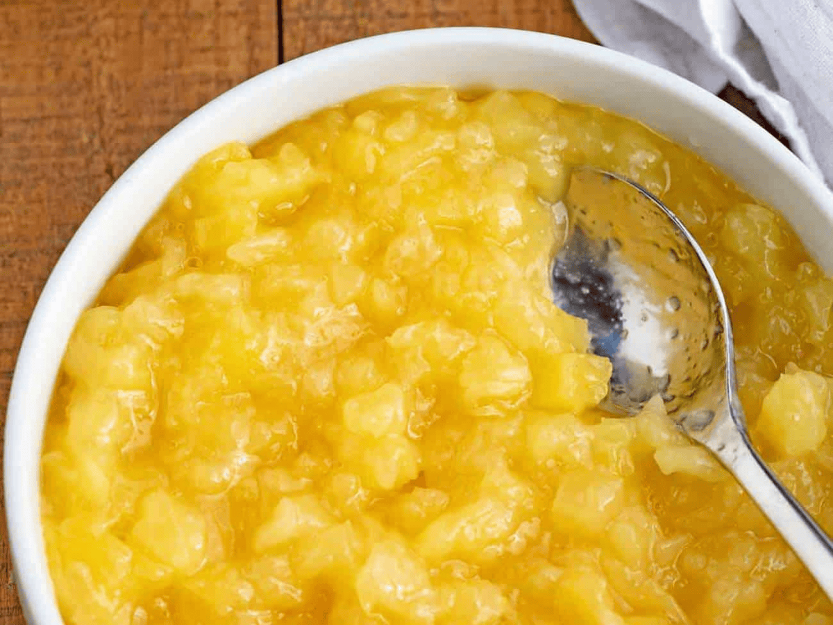 bowl of pineapple with a spoon 