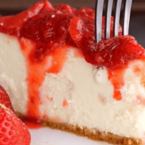 topping on cheesecake with fork