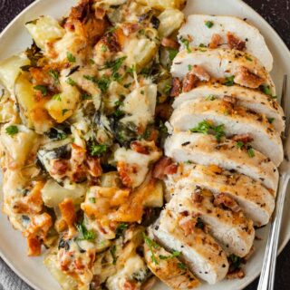 Gratin Potatoes plated with sliced chicken breast.