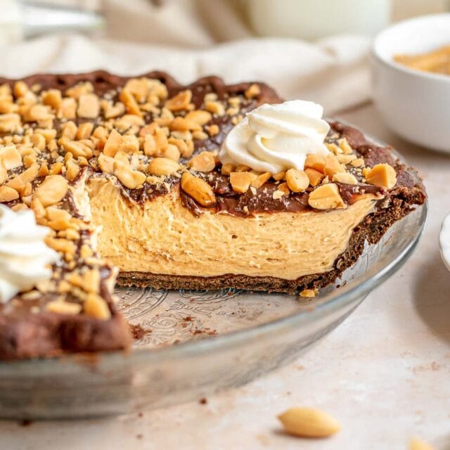 Pie in a glass dish with a slice removed