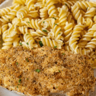 Chicken served on plate with pasta