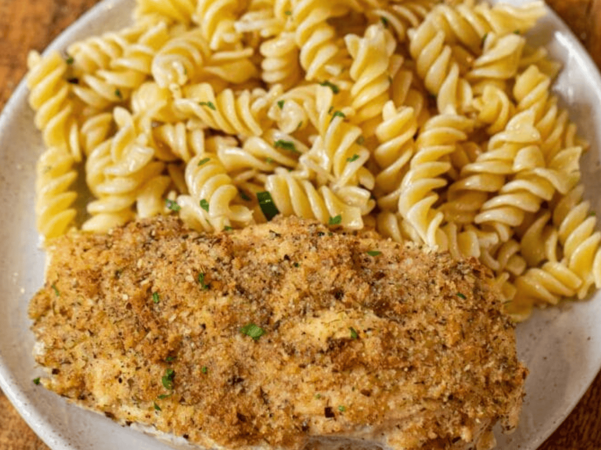 Chicken served on plate with pasta