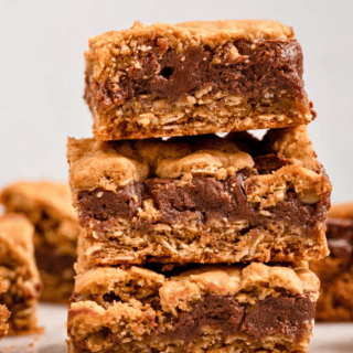 cocoa oat bars cut into squares stacked on top of each other