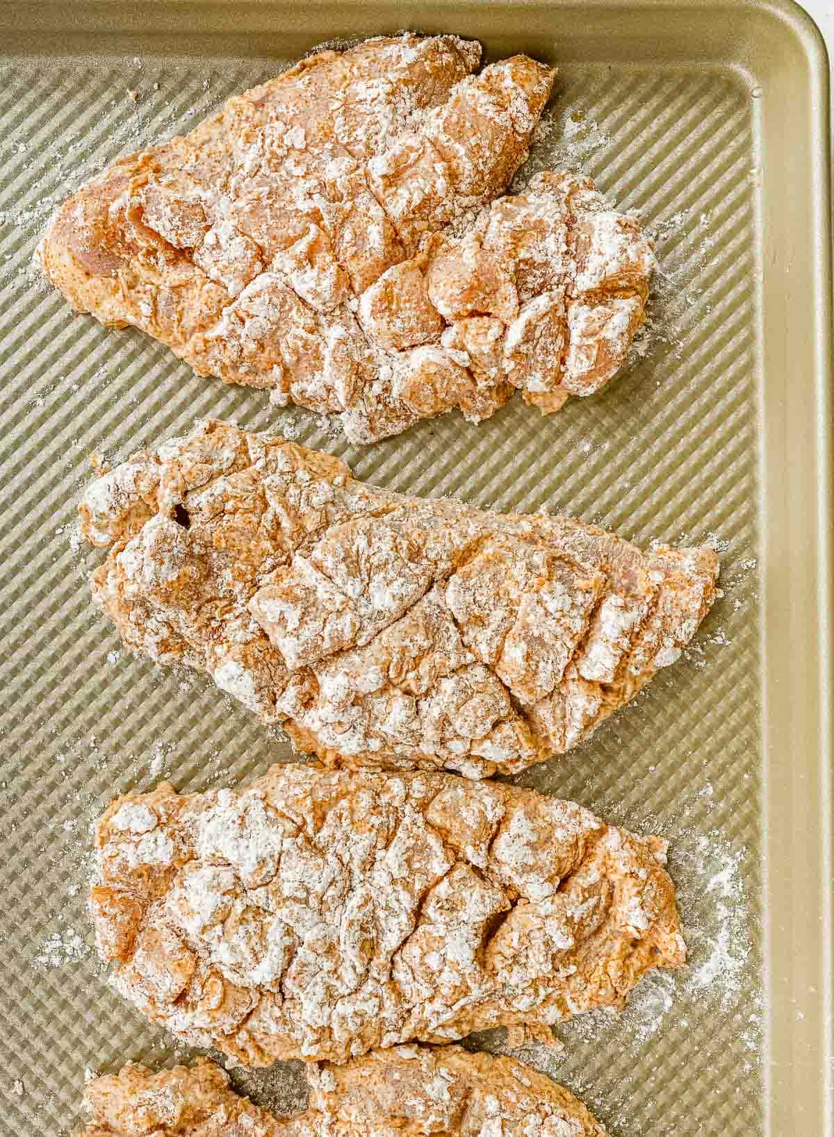 Seasoned chicken on tray
