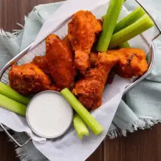 Wings in basket with celery and dressing