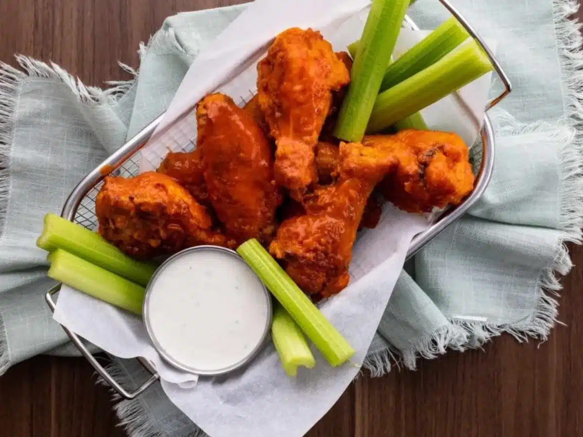Wings in basket with celery and dressing