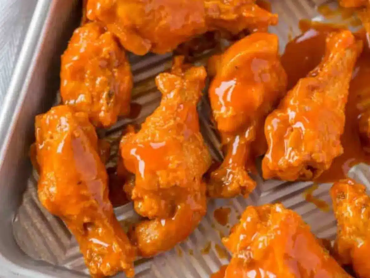 Close up of wings on baking sheet