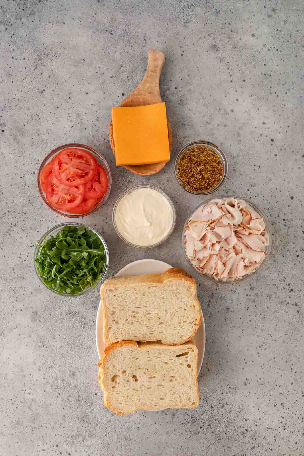 Turkey Sandwich ingredients spread out in prep bowls