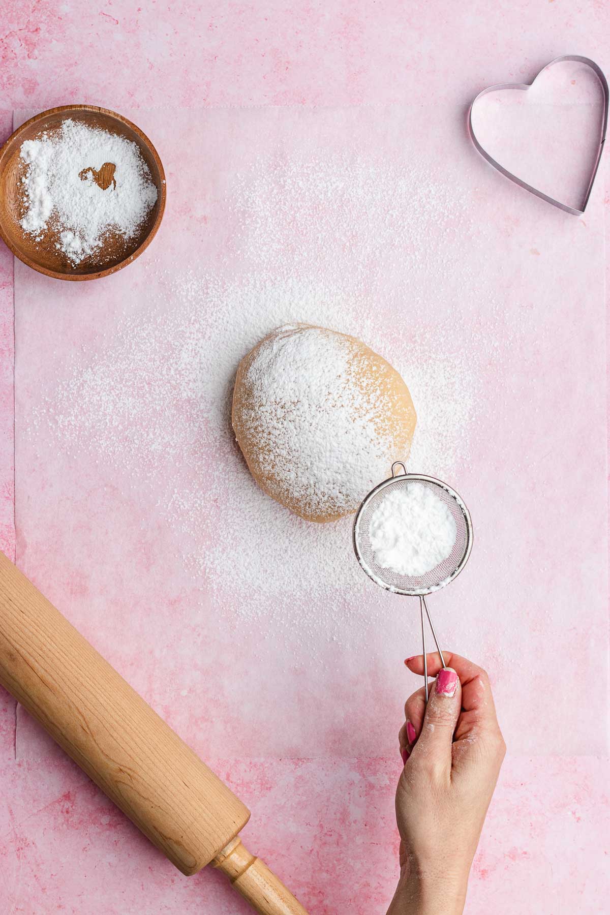 dusting dough with powdered sugar