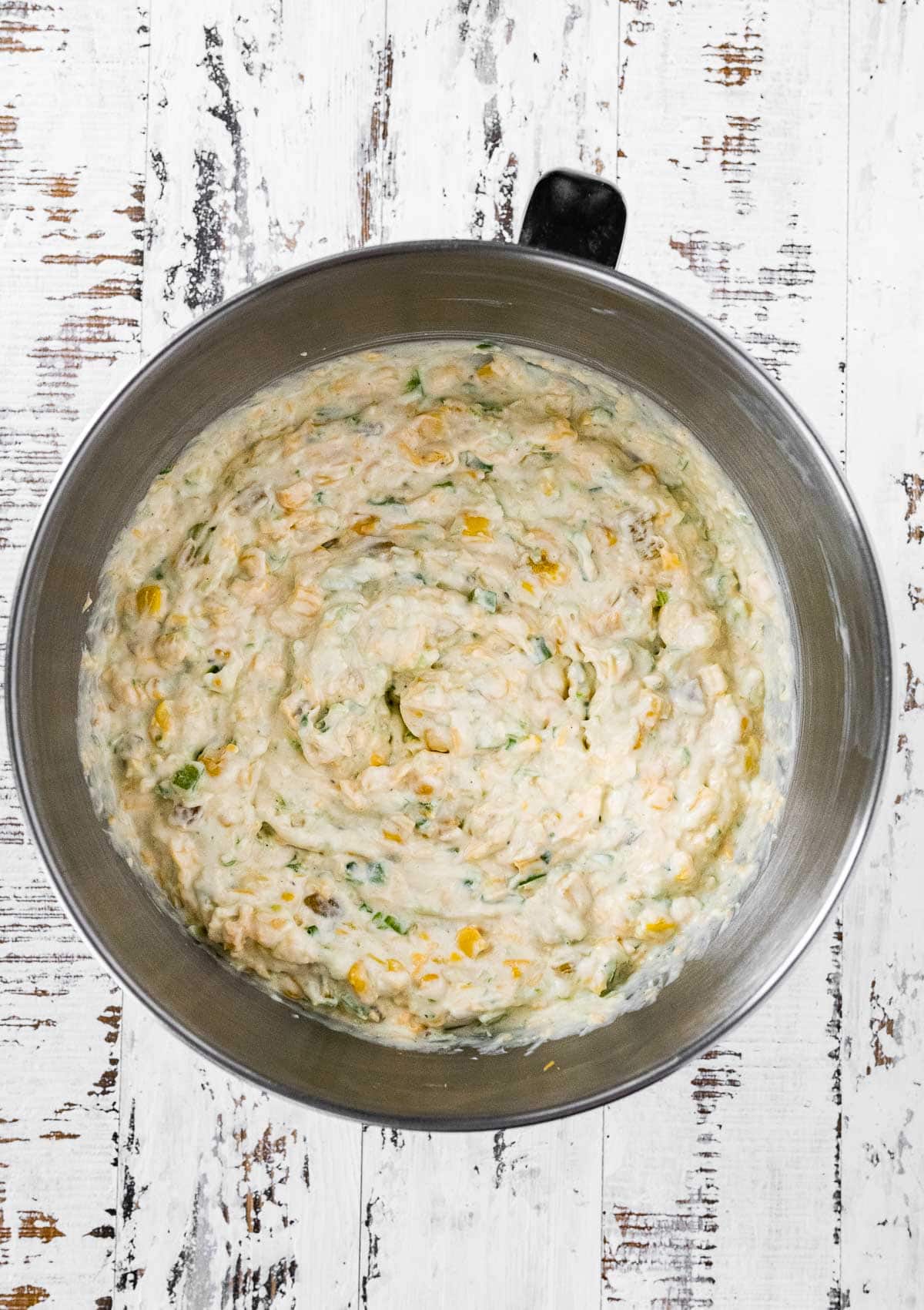 Corn Dip mixed in metal mixing bowl