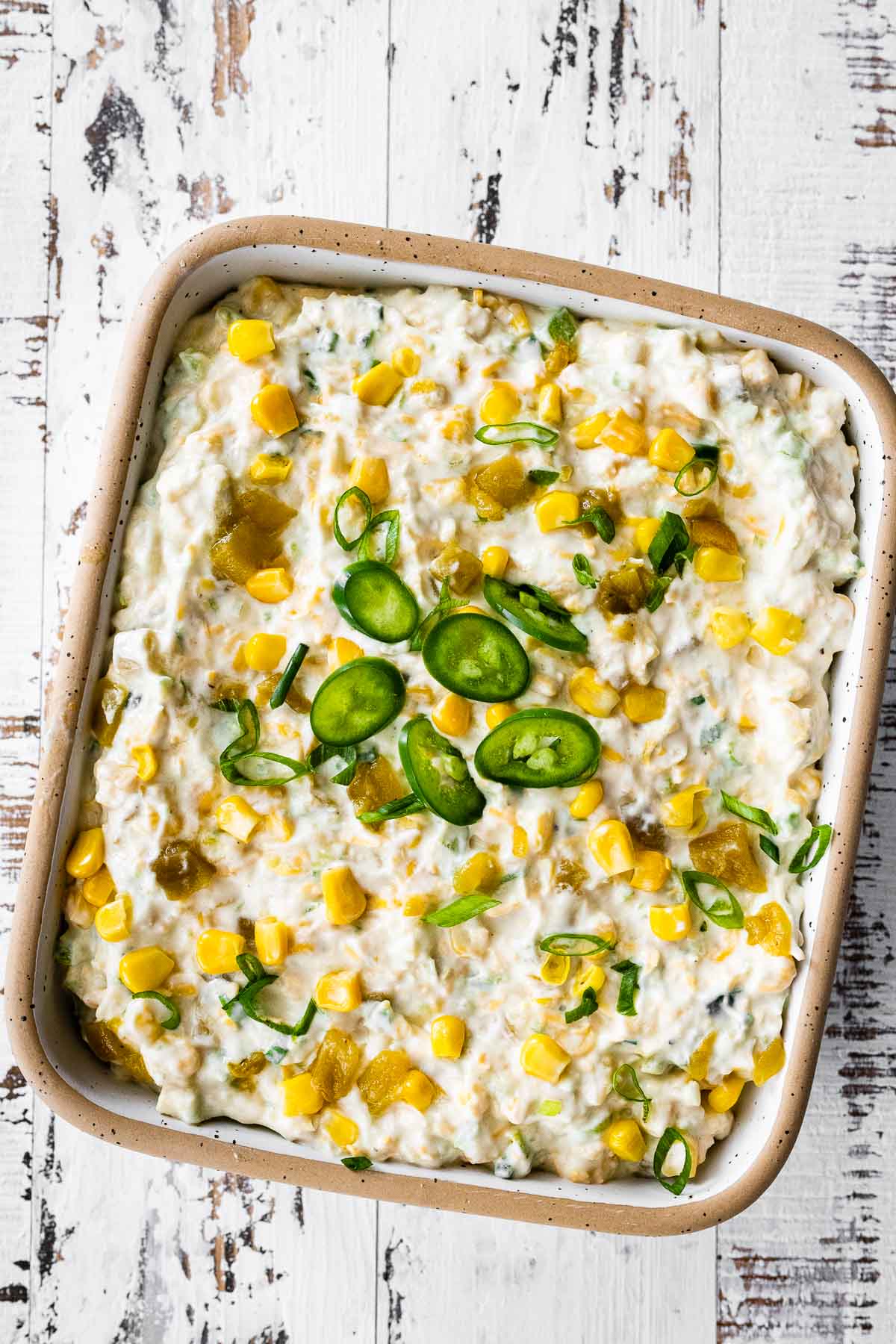 Corn Dip finished dip in serving dish garnished with sliced jalapeno