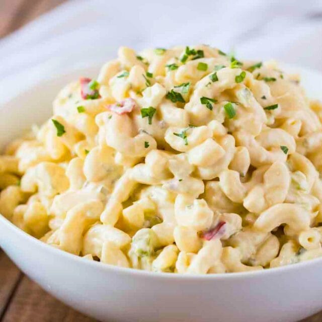 Dressed pasta in a bowl with garnish