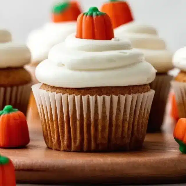 Cupcake on stand with pumpkin candies