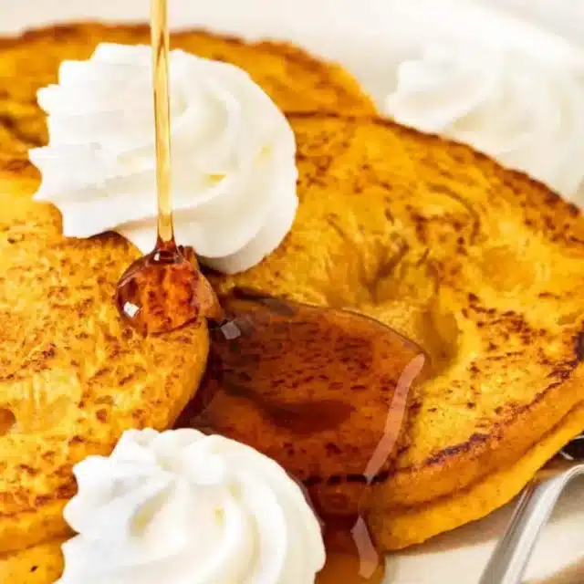 Pancakes served on plate with fork