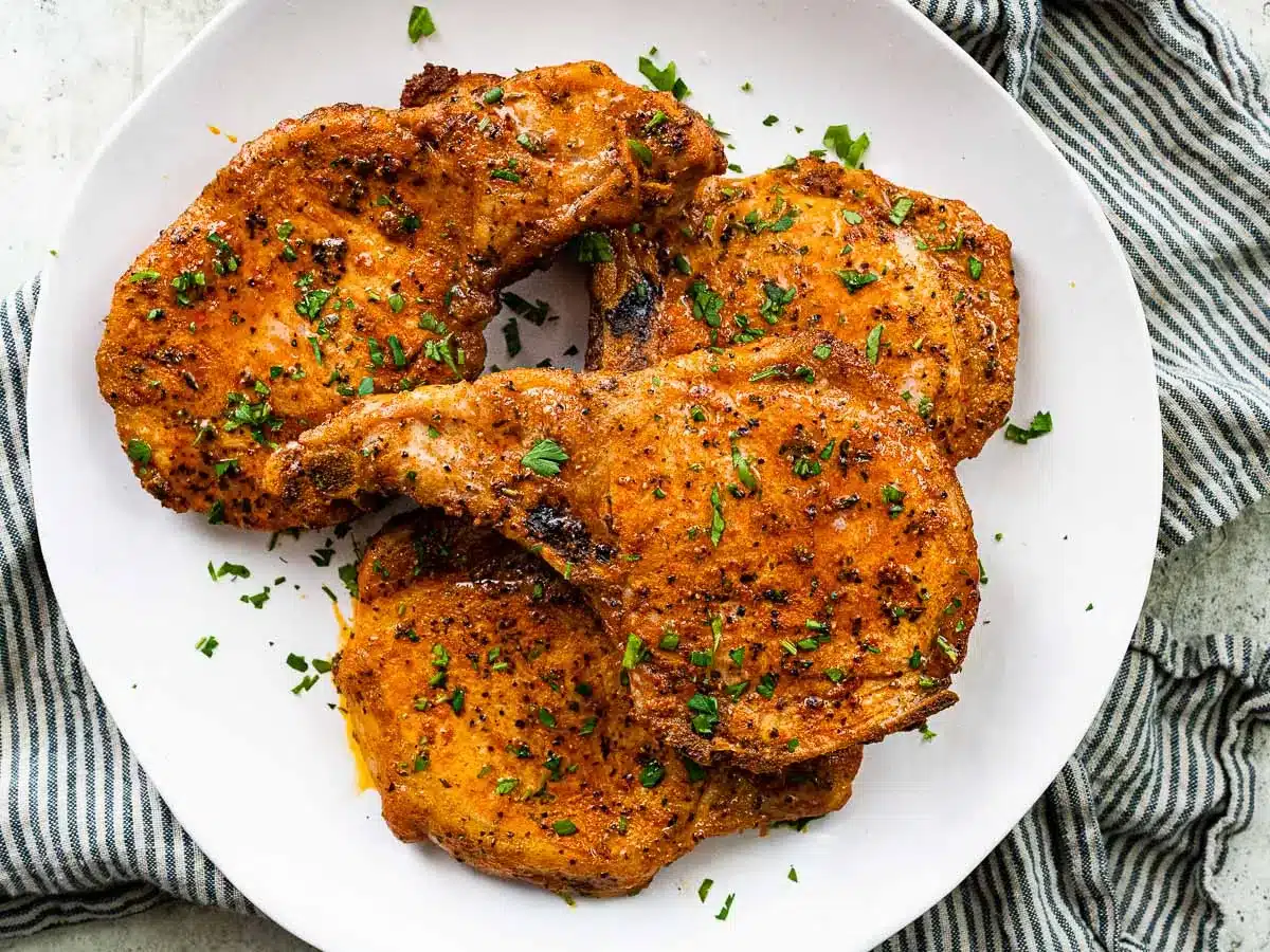 Serving plate with baked and seasoned pork.