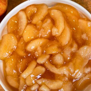 Sliced apple filling in a white bowl