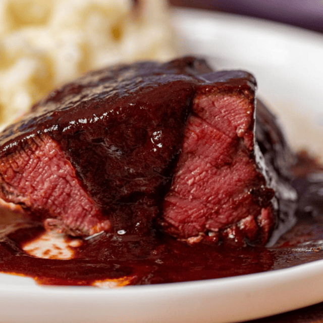 Sauce pouted over steak
