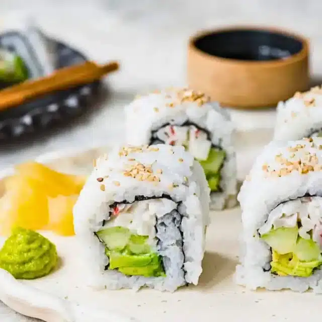 Sushi on plate with wasabi and ginger