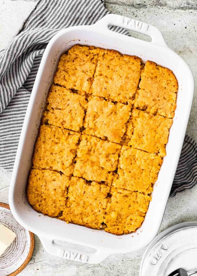 Cornbread Casserole in pan, sliced