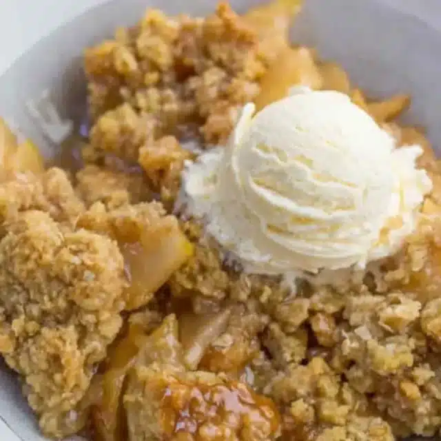 plated crisp topped with ice cream