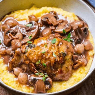 Chicken with mushrooms and onions over mashed potatoes