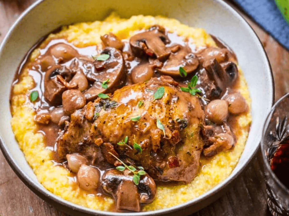 Chicken with mushrooms and onions over mashed potatoes