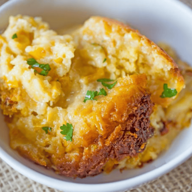 Spoonful of casserole in a white bowl