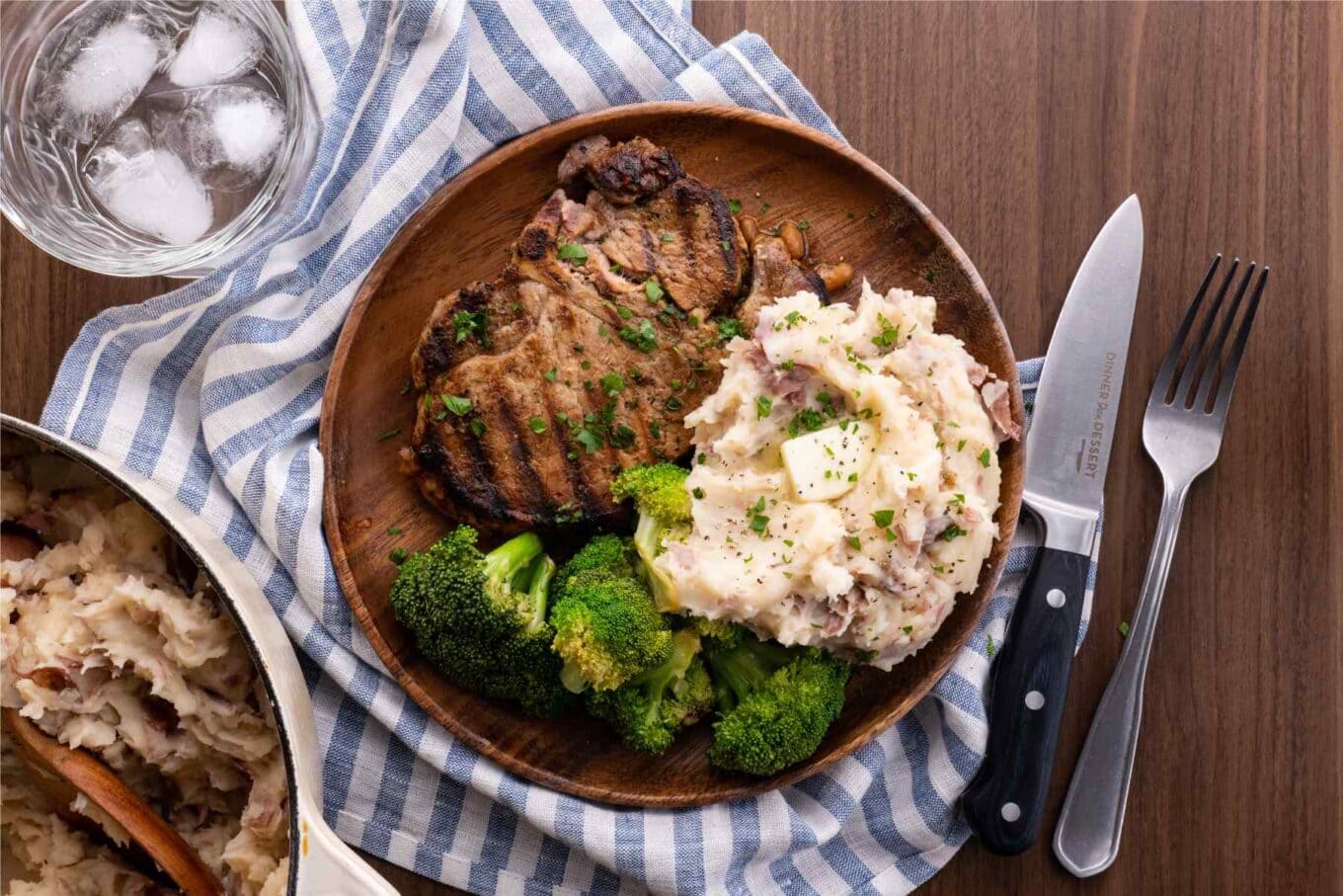 Creamy Garlic Mashed Potatoes on plate with steak and broccoli