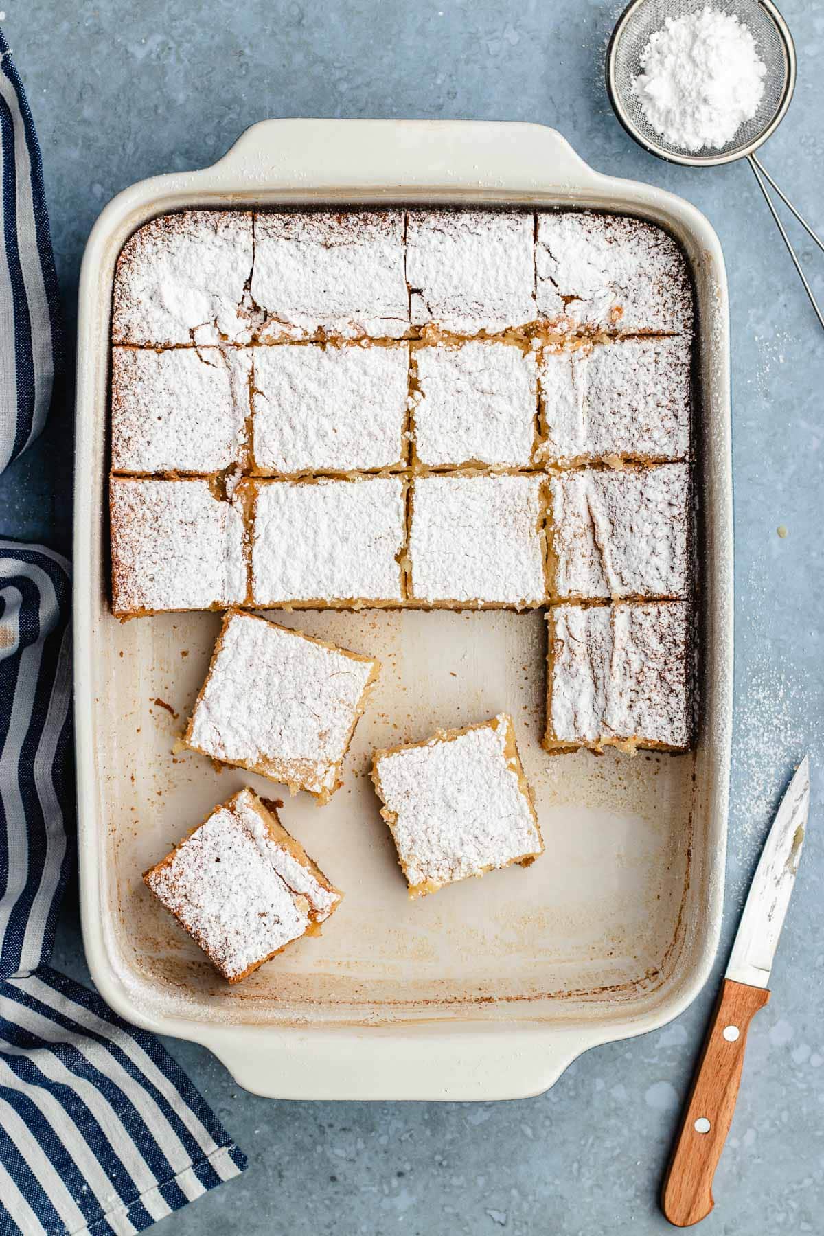 Pan with precut squares of Gooey Butter Cake inside.