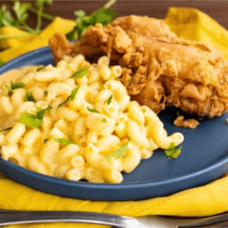 mac and cheese on a plate with fried chicken
