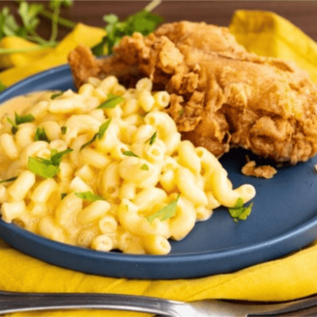 mac and cheese on a plate with fried chicken