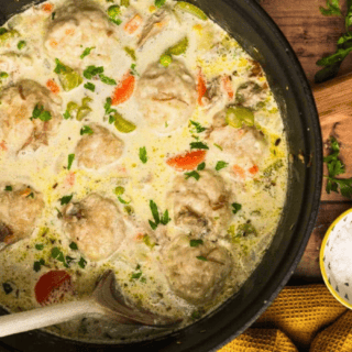 pot of with spoon in pan cooking