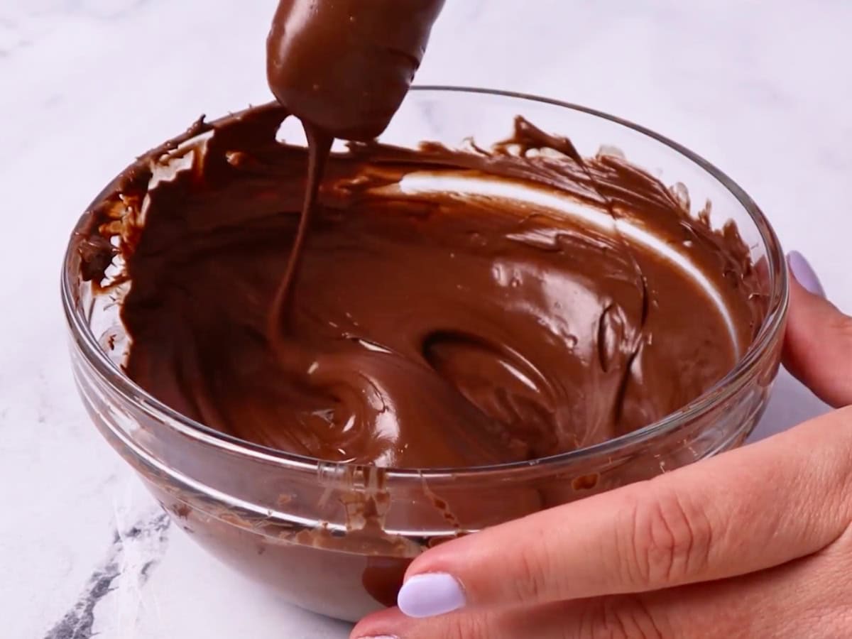 Melted chocolate in a glass bowl