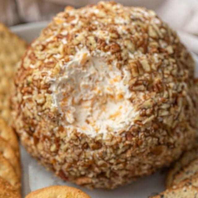 Cheese on a platter with crackers.