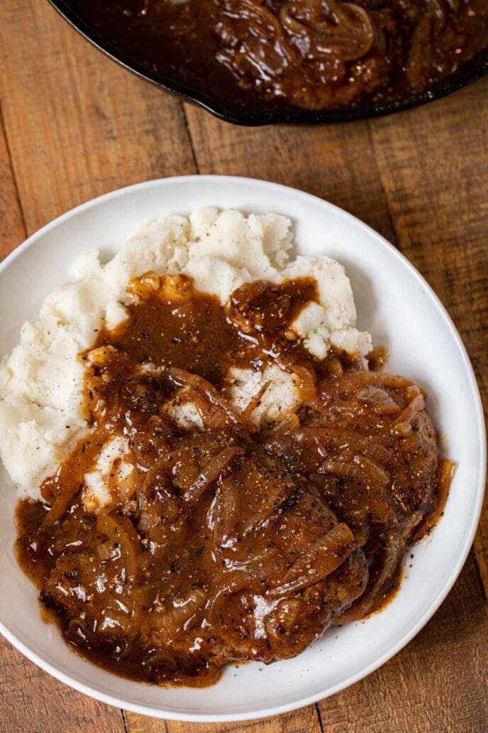 steak and onions served with gravy