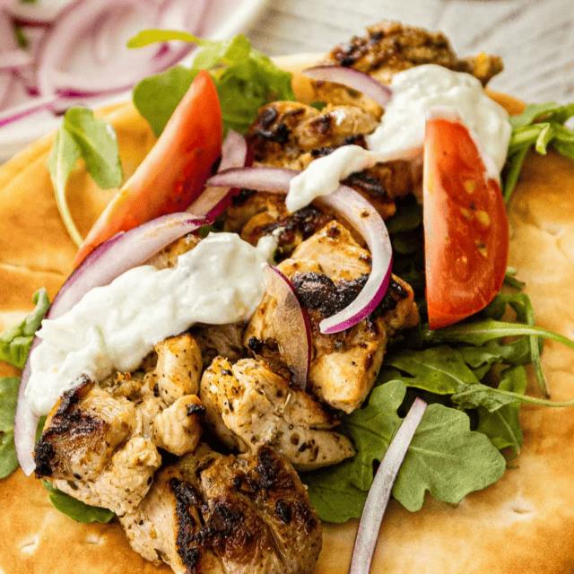 Grilled chicken in pita wrap with yogurt sauce.