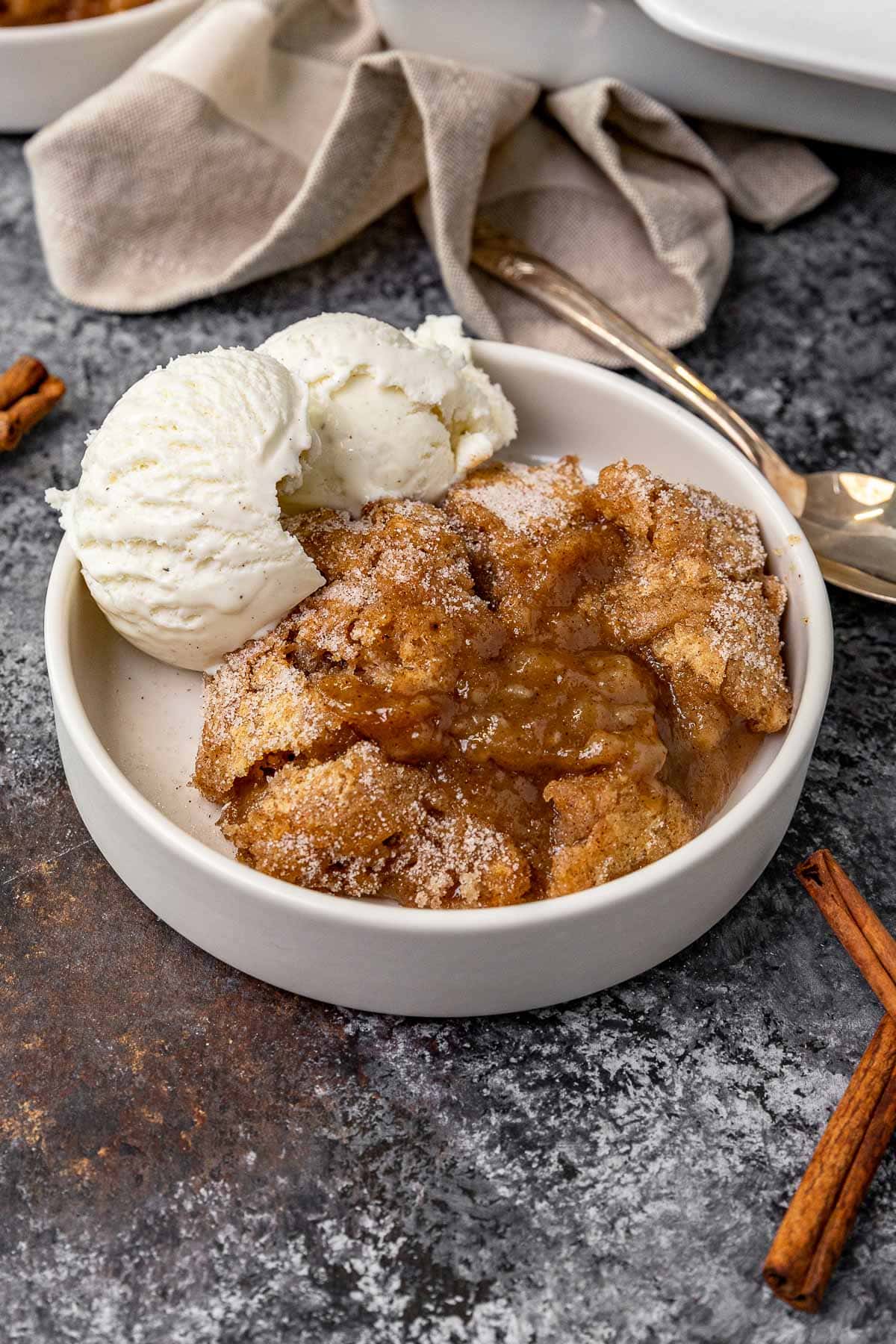Snickerdoodle Cobbler in bowl with ice cream