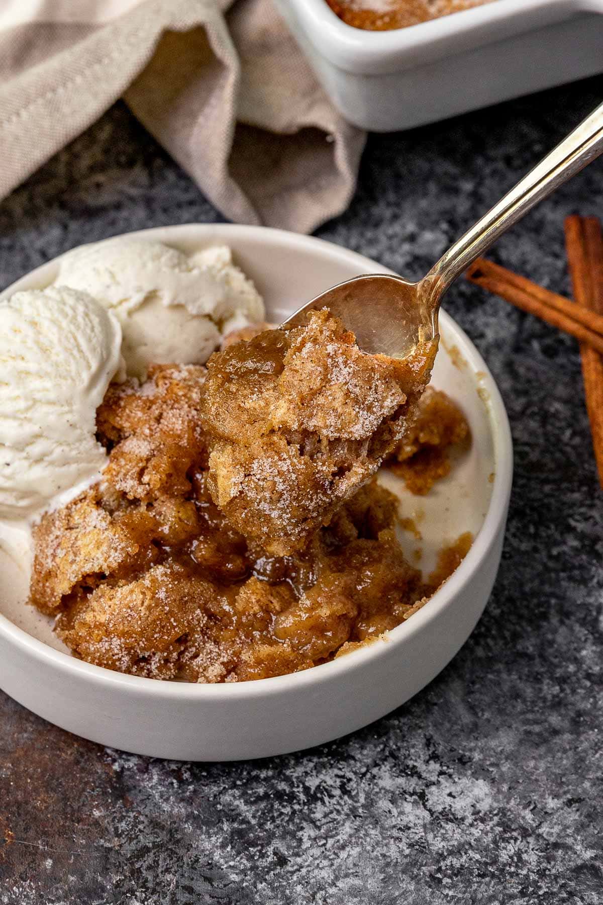 Snickerdoodle Cobbler in bowl with ice cream