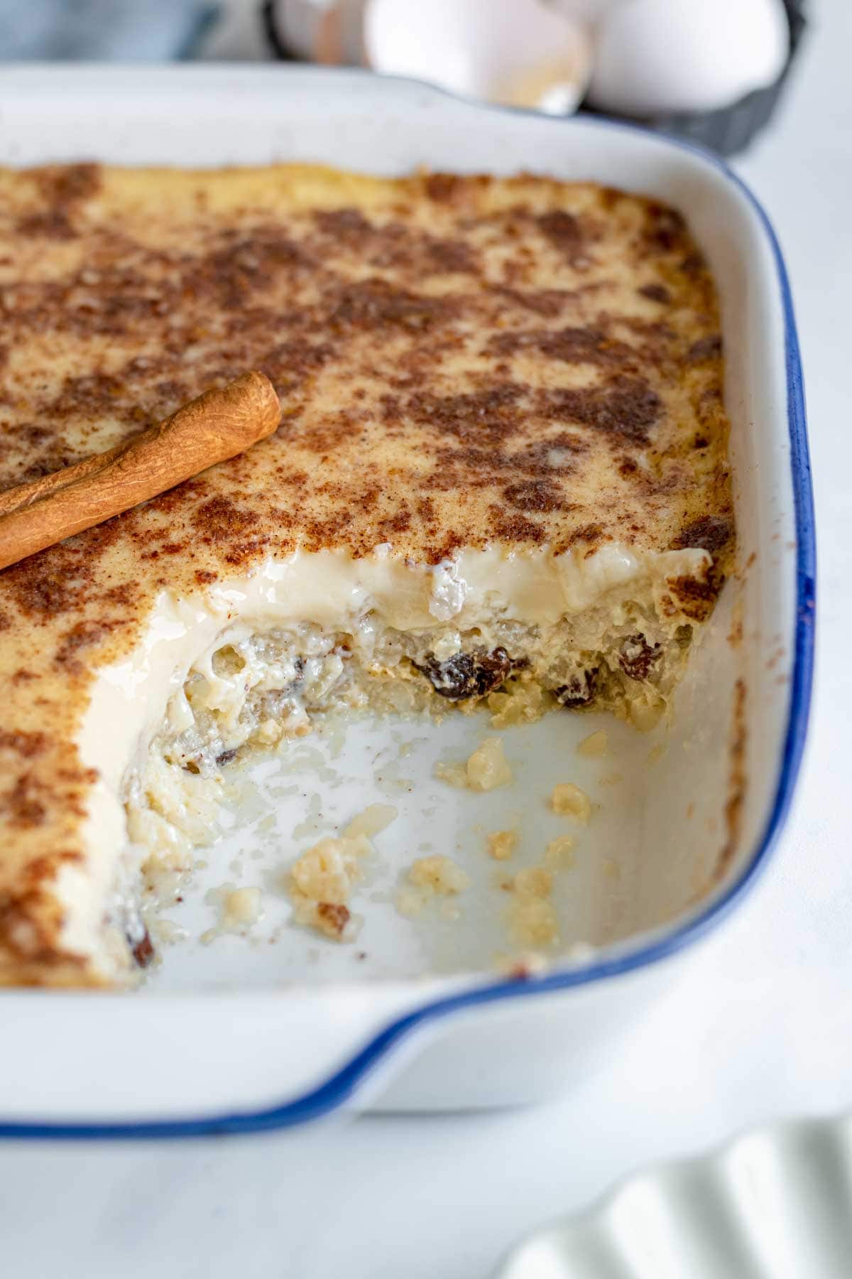 Baked Rice Pudding cooked pudding in a baking dish serving missing