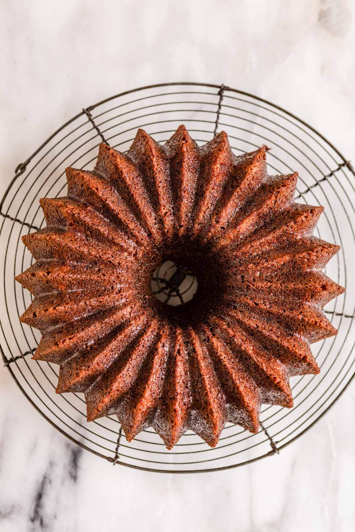 Banana Bundt Cake baked cake inverted on wire cooling rack, view from above