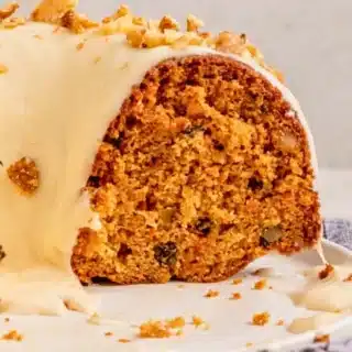 Frosted Bundt cake with slice taken out