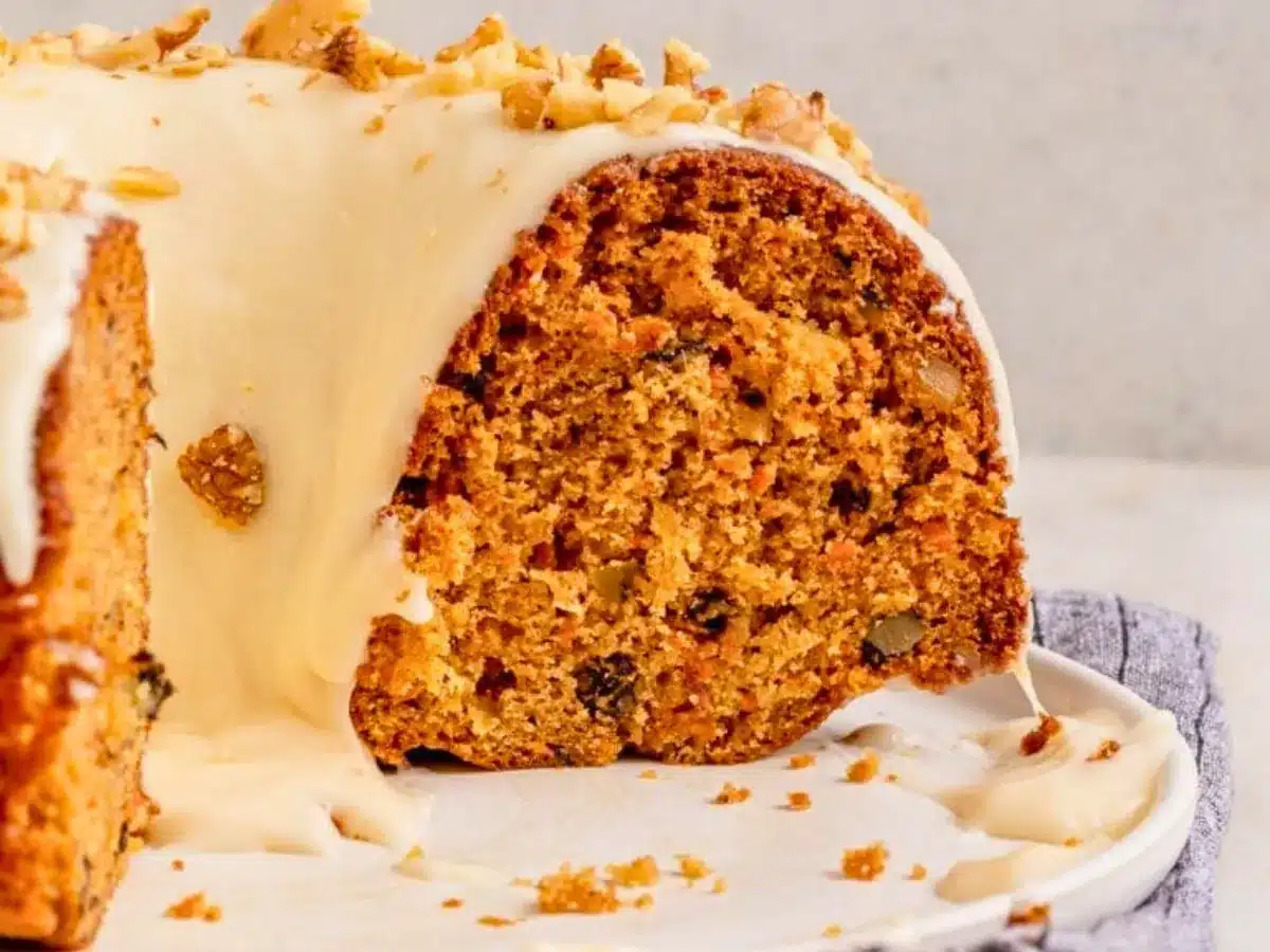 Frosted Bundt cake with slice taken out