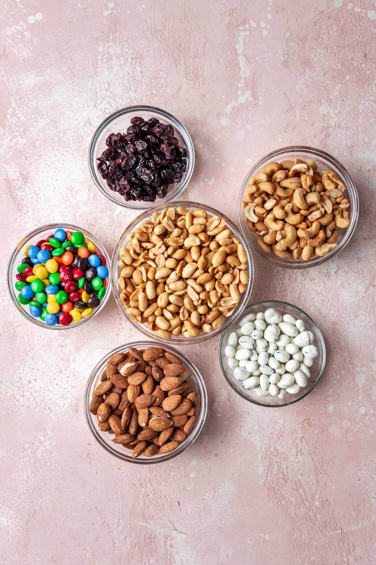 Classic Trail Mix ingredients in separate bowls, top down view